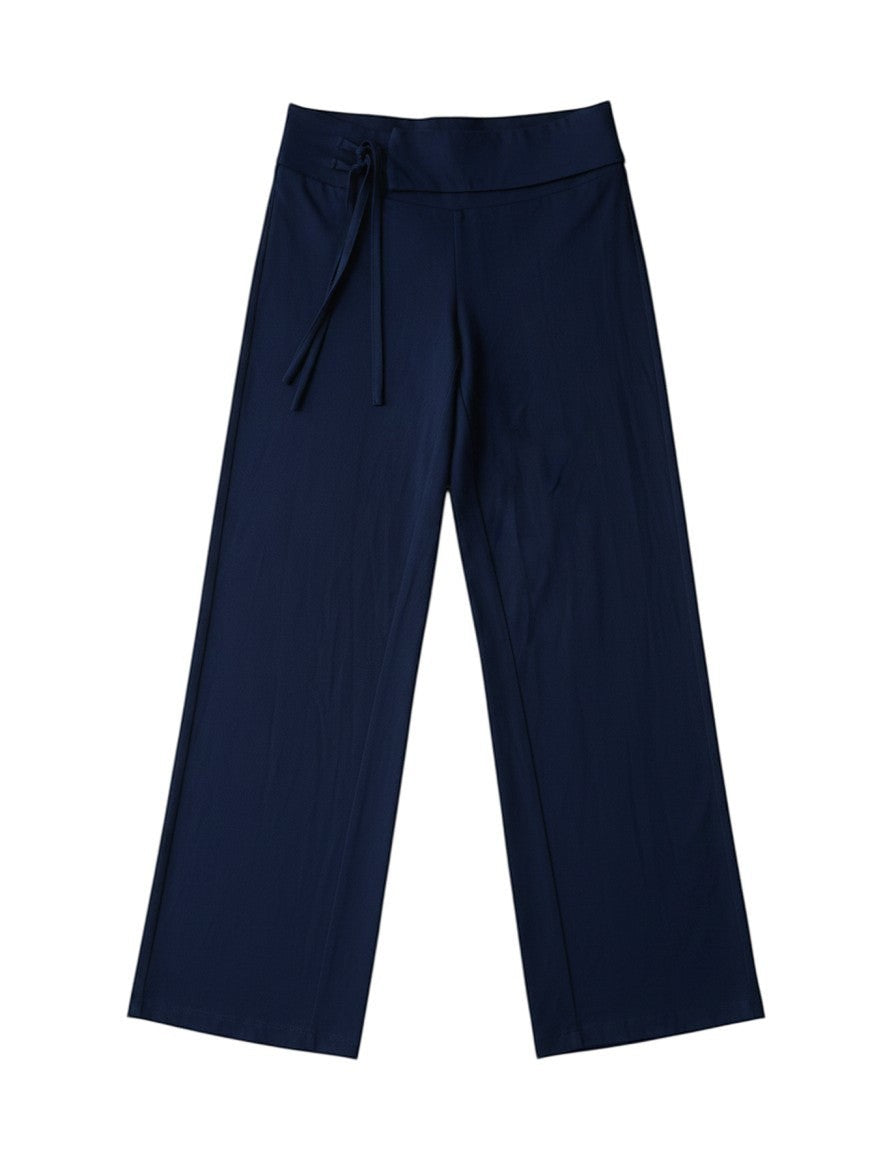 FSociety navy blue wide-leg pants with a fold-over waistband and decorative multi-strand tie detail on the hip.